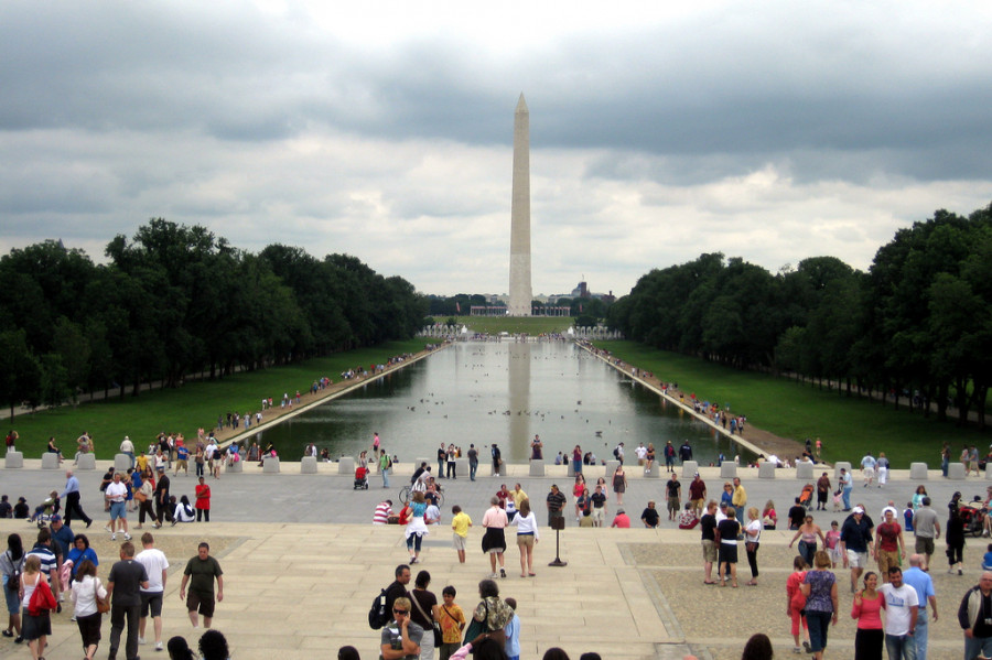 The Washington Monument and Reflecting Pool with crowds of people